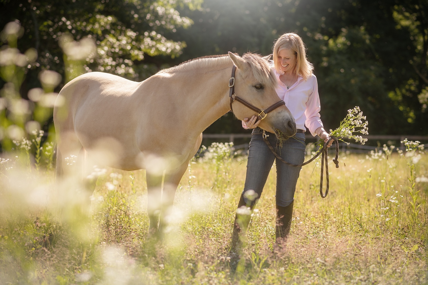 Melissa in wildflowers with horse.